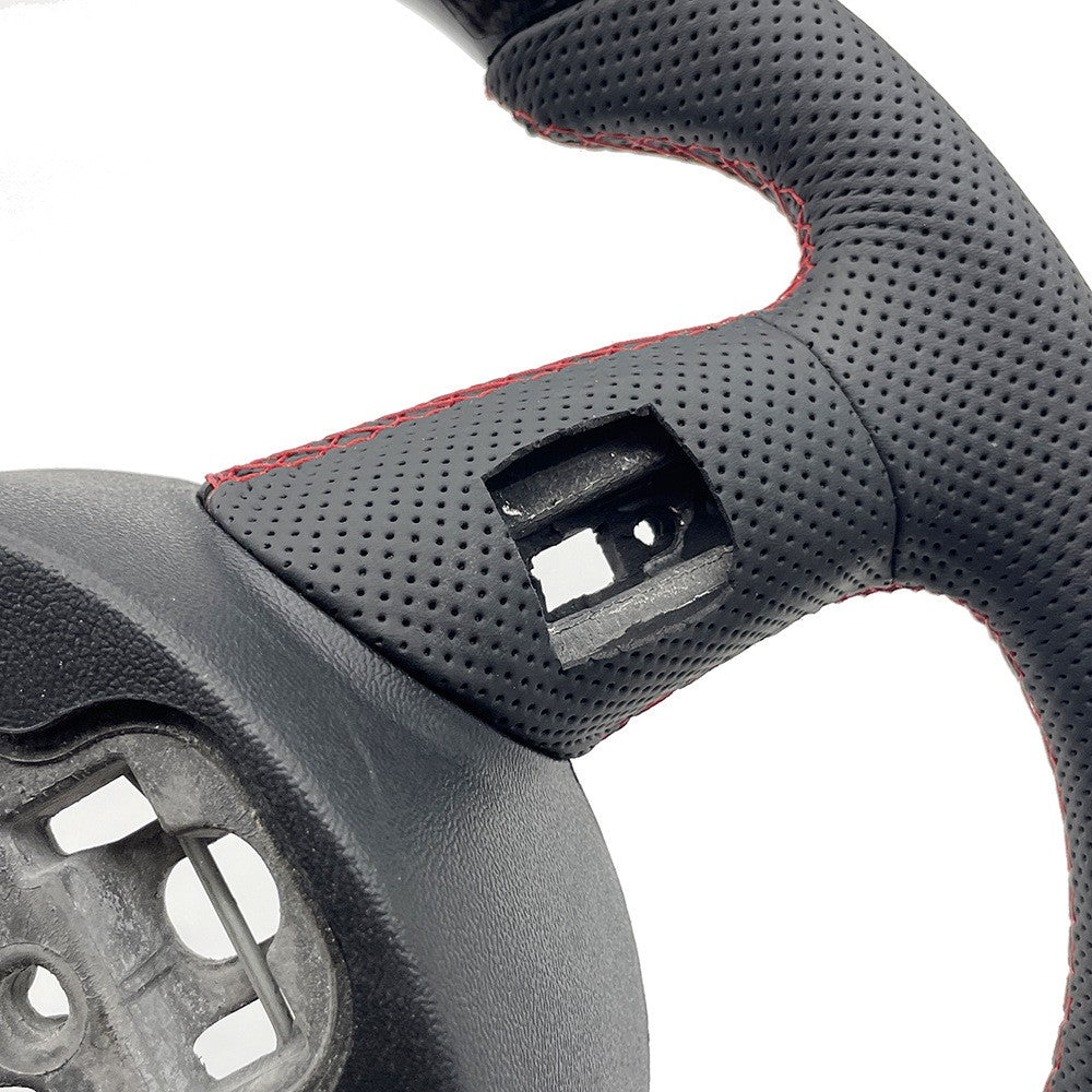 Suitable for Audi A6C7 carbon fiber semi perforated paddle holes, red and yellow dual color return to the correct direction on the bottom of the steering wheel
